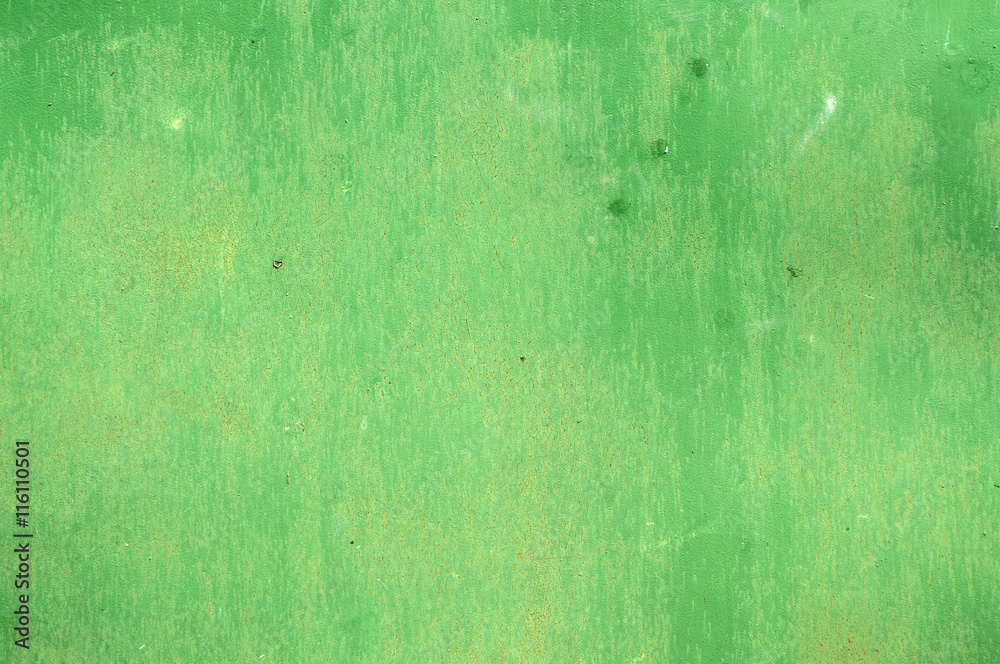 Obraz premium Green painted weathered tin surface closeup as background