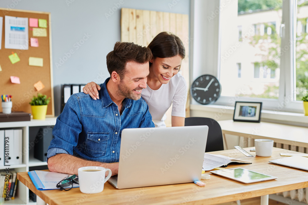 Casual business partners working together at the office Casual business partners working together at the office