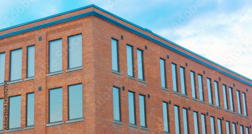 фотографія red brick building corner perspective horizontal view