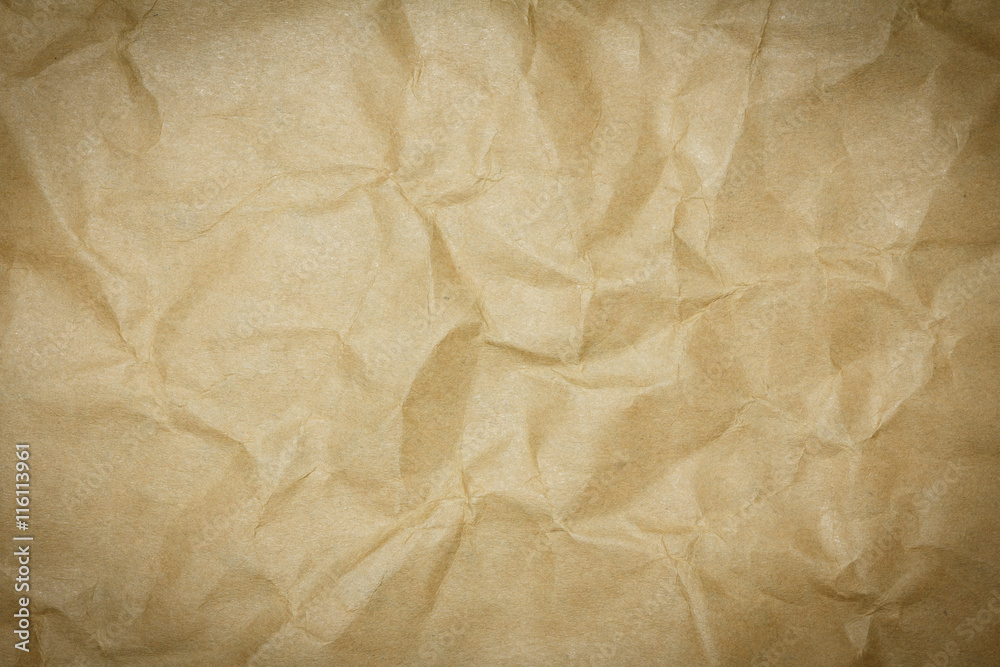 Crumpled brown paper texture or paper background for design with copy space for text or image. Dark edged. Crumpled brown paper texture or paper background for design with copy space for text or image. Dark edged.