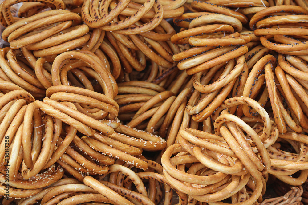 Background of a large number of spilling bread-ring. Food