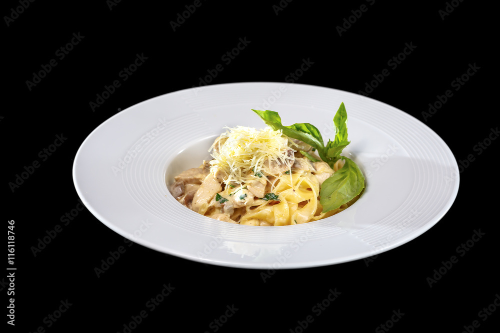 Pasta with mushrooms on black background, isolated.