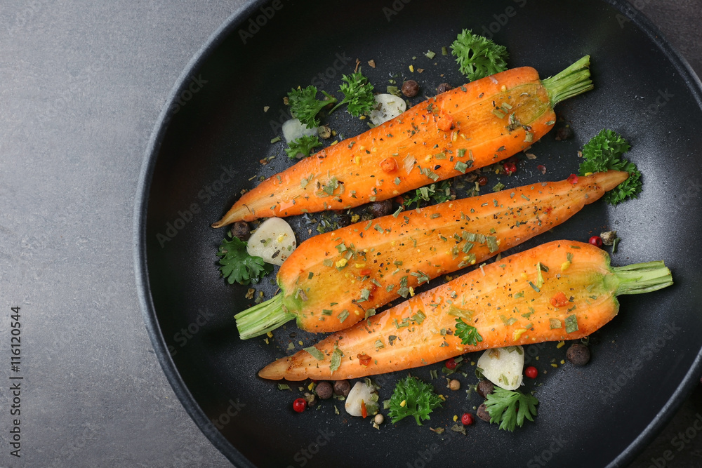 Healthy food and ingredients with sliced carrots, parsley and spices in a pan Healthy food and ingredients with sliced carrots, parsley and spices in a pan