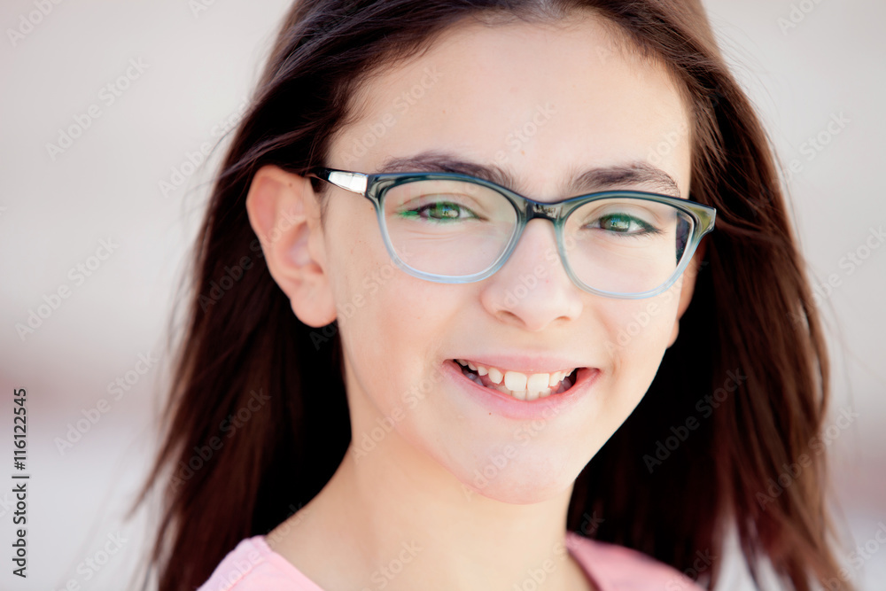Pretty preteenager girl with glasses outside