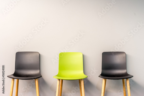 Modern chairs by the wall
