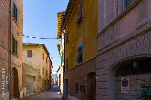 Narrow European town street with sea view. No Parking sign in Italian. Orbetello  Italy