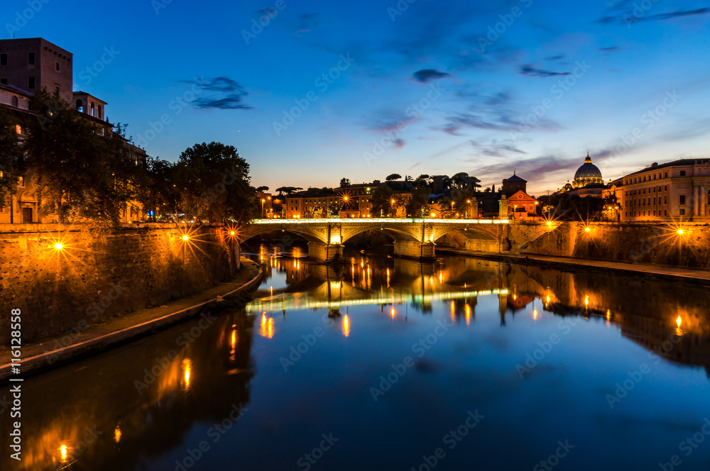 Castle Saint Angel and bridge over the Tiber river on sunset. Night cityscape of Rome landmarks with copy space. Italy