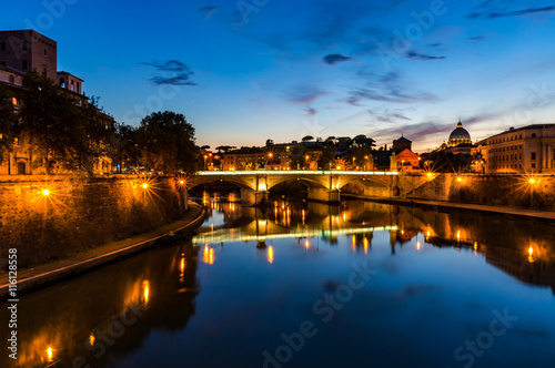 Castle Saint Angel and bridge over the Tiber river on sunset. Night cityscape of Rome landmarks with copy space. Italy