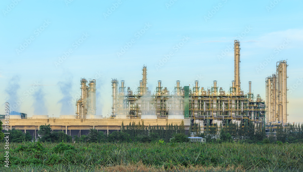 Oil refinery plant with blue sky for energy industry background.