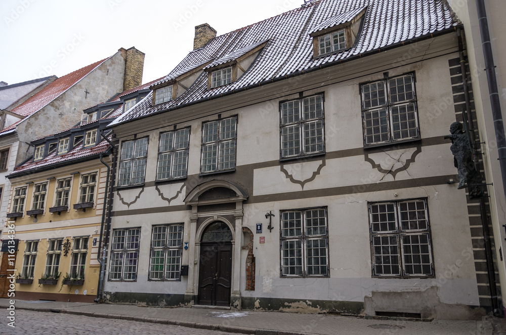 Riga, Latvia. Traditional medieval houses in street of Riga old town. Winter and snow.