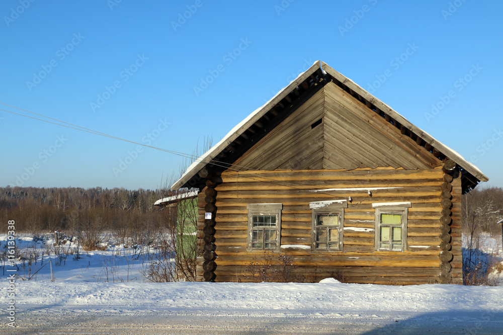 House in a village in a winter day House in a village in a winter day