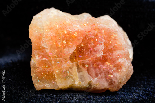 Nice uncut sunstone crystal with copper inclusions. photo