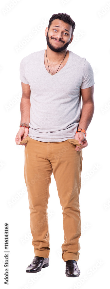 Poor latino man with beard cutout image. He shows that he has nothing while turns out his pocket. Looks sad and upset. White background isolated. Full length portrait. Poor latino man with beard cutout image. He shows that he has nothing while turns out his pocket. Looks sad and upset. White background isolated. Full length portrait.