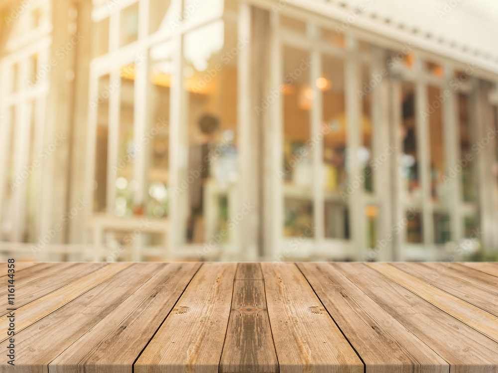 Wooden board empty table in front of blurred background. Perspective brown wood over blur in coffee shop - can be used for display or montage your products.Mock up for display of product. Wooden board empty table in front of blurred background. Perspective brown wood over blur in coffee shop - can be used for display or montage your products.Mock up for display of product.