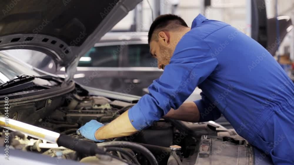 mechanic man with wrench repairing car at workshop 52 mechanic man with wrench repairing car at workshop 52