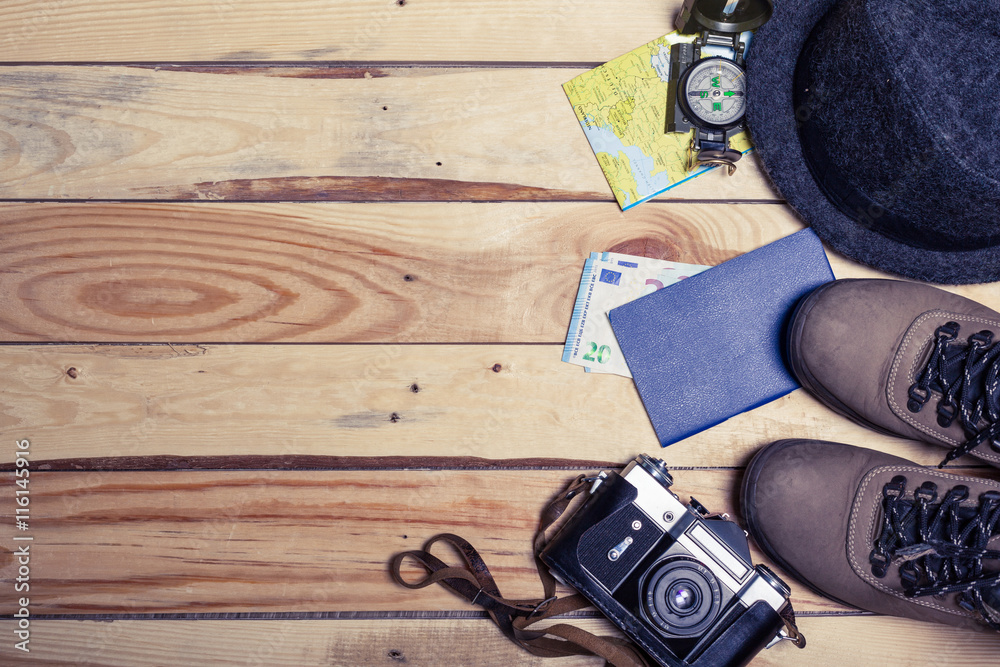 Accessories for travel. Passport, photo camera and travel map. Top view. Holidays and tourism concept Accessories for travel. Passport, photo camera and travel map. Top view. Holidays and tourism concept