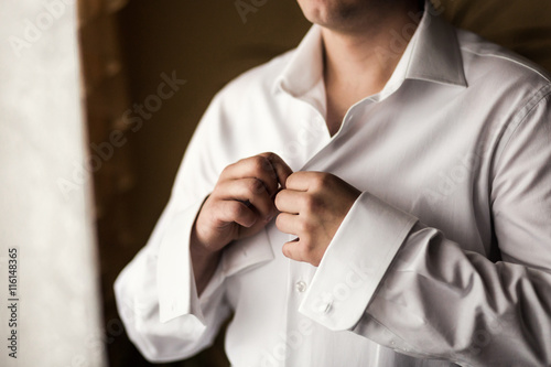 Businessman dress shirt. The man in the white shirt in the windo