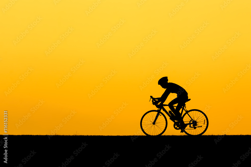 A Silhouette of man cycling