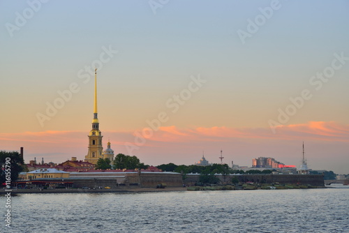 Peter and Paul fortress at sunset under the pink clouds
