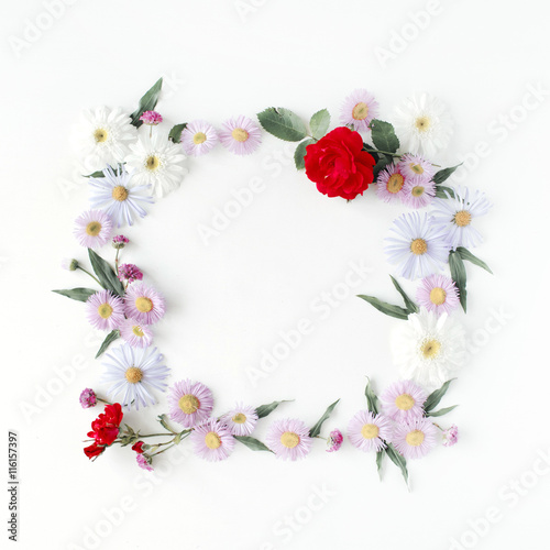 Fototapeta Naklejka Na Ścianę i Meble -  round frame wreath pattern with roses, pink flower buds, branches and leaves isolated on white background. flat lay, top view