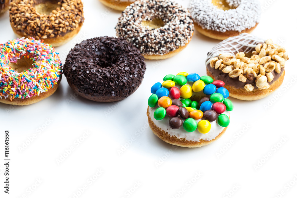 Delicious donuts with icing isolated on white Delicious donuts with icing isolated on white