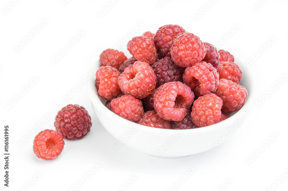 Raspberries in a bowl isolated on white background Raspberries in a bowl isolated on white background