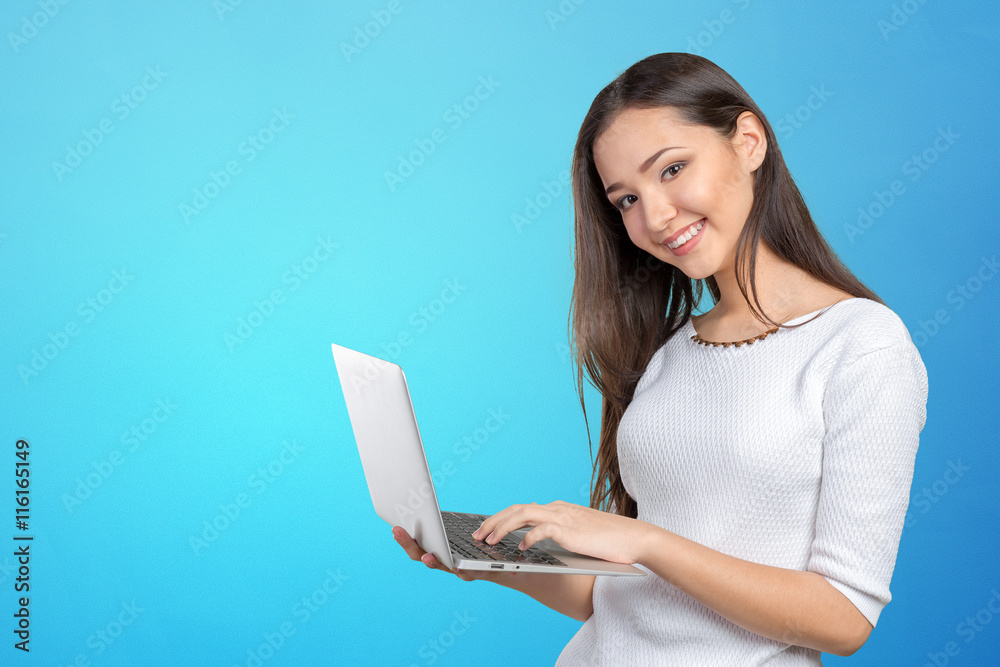 portrait of beautiful young woman holding laptop isolated portrait of beautiful young woman holding laptop isolated