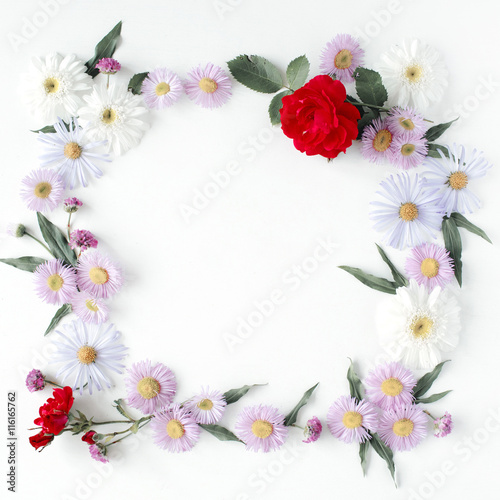 round frame wreath pattern with roses, pink flower buds, branches and leaves isolated on white background. flat lay, top view