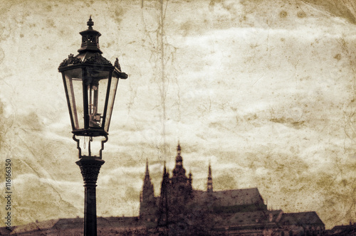 Old grunge picture with street lamp in Prague