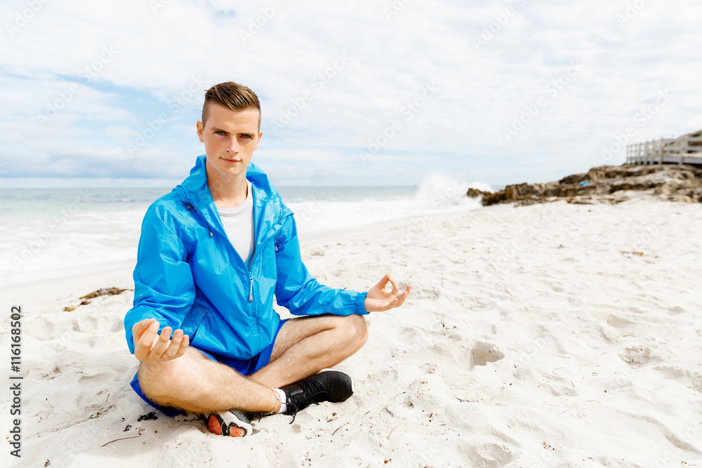Man training on beach outside Man training on beach outside