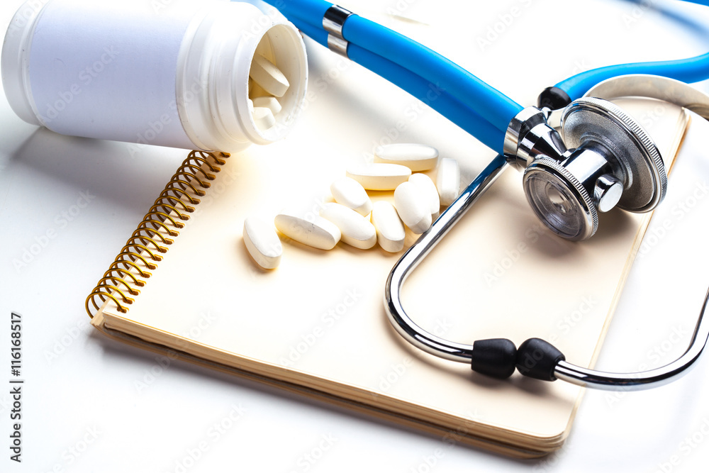 Empty prescription lying on table with stethoscope Empty prescription lying on table with stethoscope