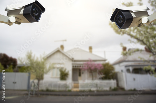 CCTV Security Camera with house in background