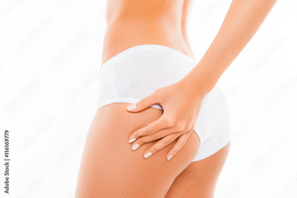Close up portrait of shapely woman checking cellulite on her ass