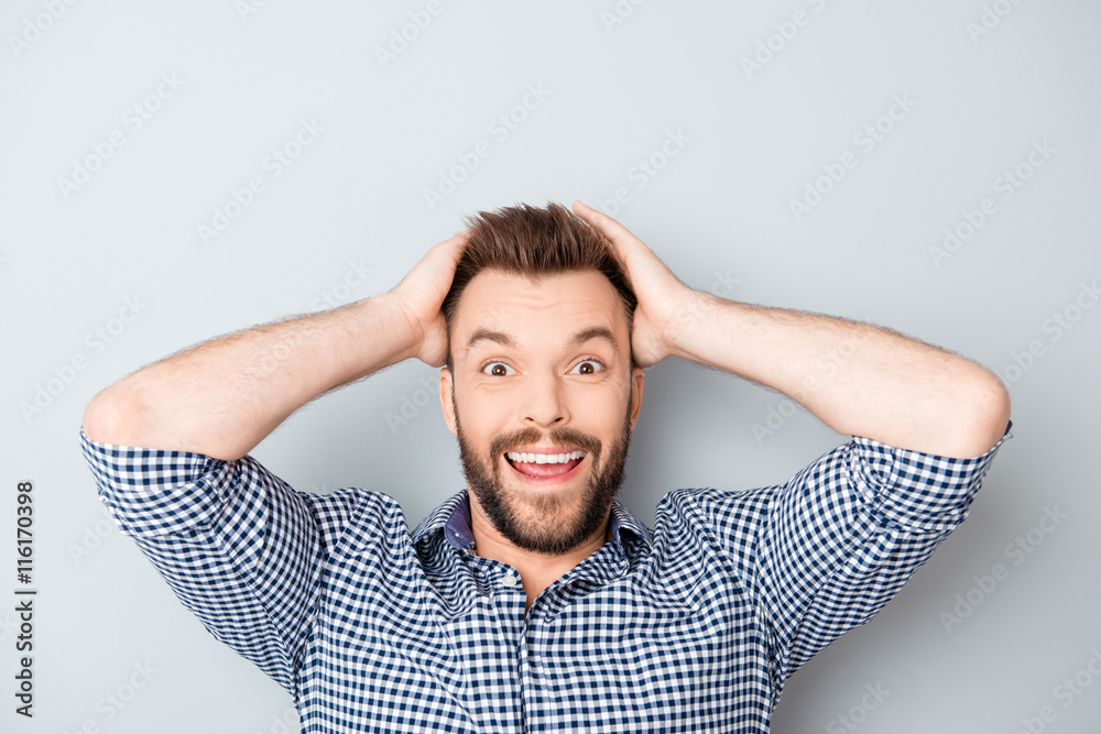 Portrait of cheerful glad happy man touching head Portrait of cheerful glad happy man touching head