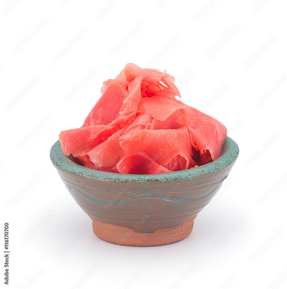 Pickled ginger in a clay sauce-boat isolated on white background Pickled ginger in a clay sauce-boat isolated on white background