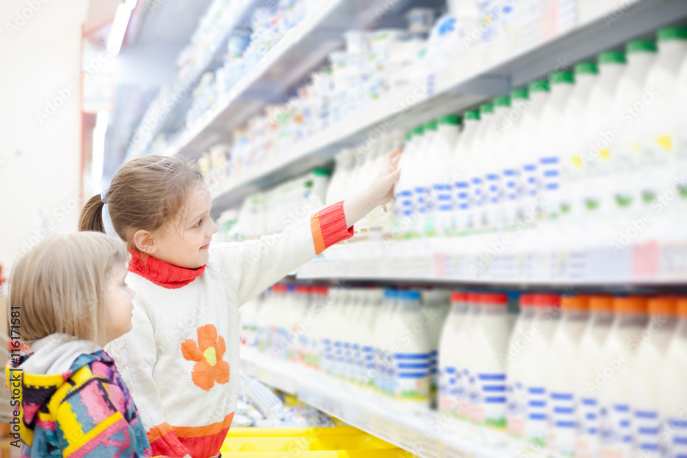 children in   store at   shelves with products.