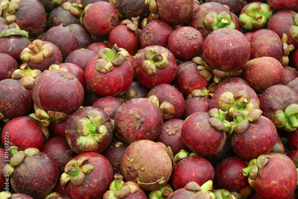 mangosteen is a popular and famous fruit in The market Thailand, mangosteen texture background.
