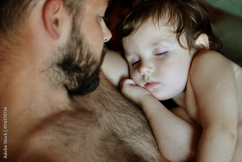 son asleep on the shoulder of his father son asleep on the shoulder of his father