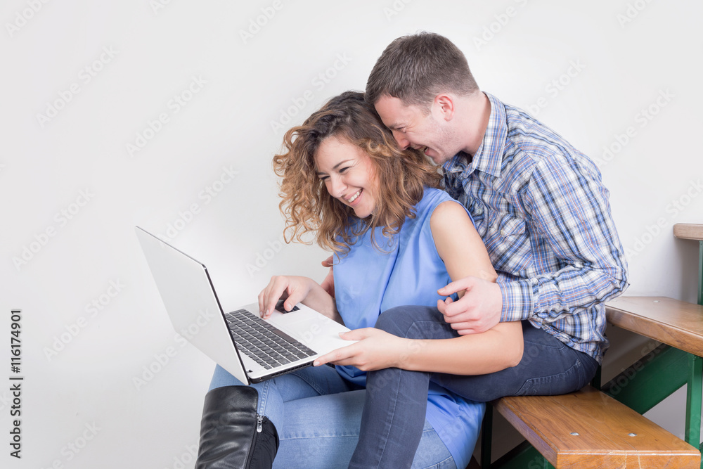 Happy couple using a laptop Happy couple using a laptop