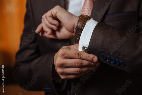 Businessman hands with cufflinks. Elegant gentleman clother