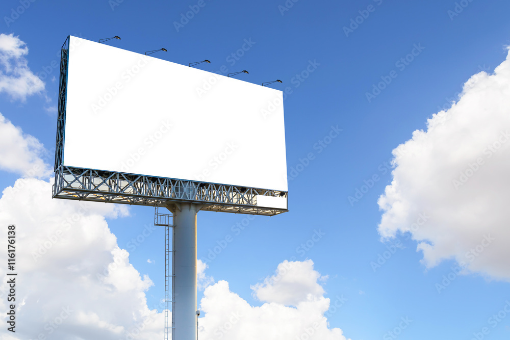 Blank billboard with blue sky and clouds for advertisement.