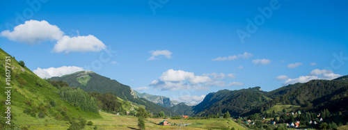 Green field with mountains in background