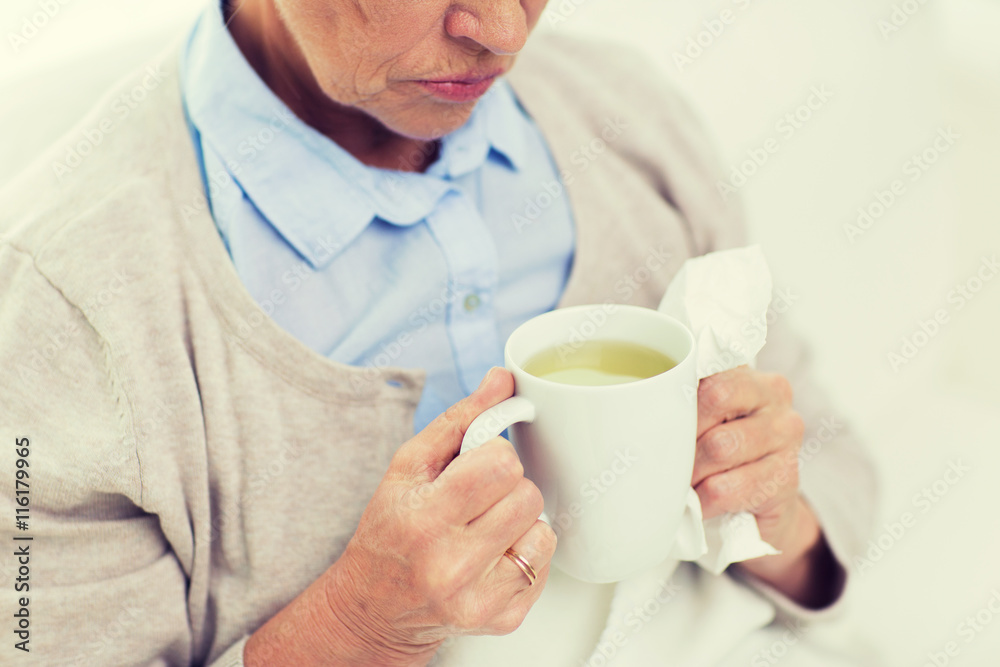 close up of sick senior woman drinking tea at home close up of sick senior woman drinking tea at home