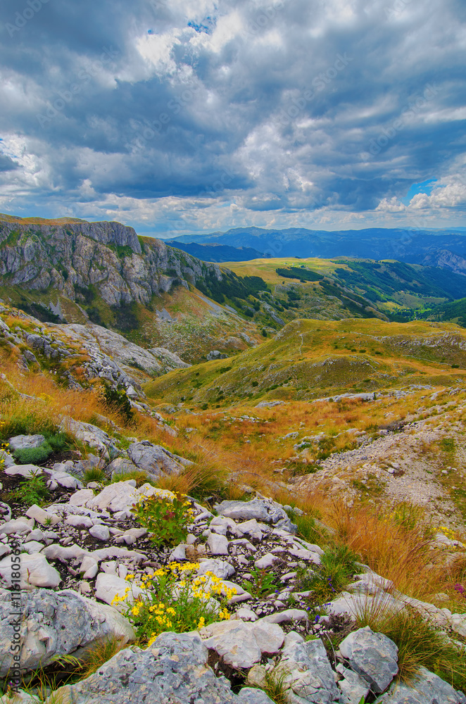 Montenegro, national park Durmitor, mountains and clouds panorama. Sunlight lanscape. Nature travel background