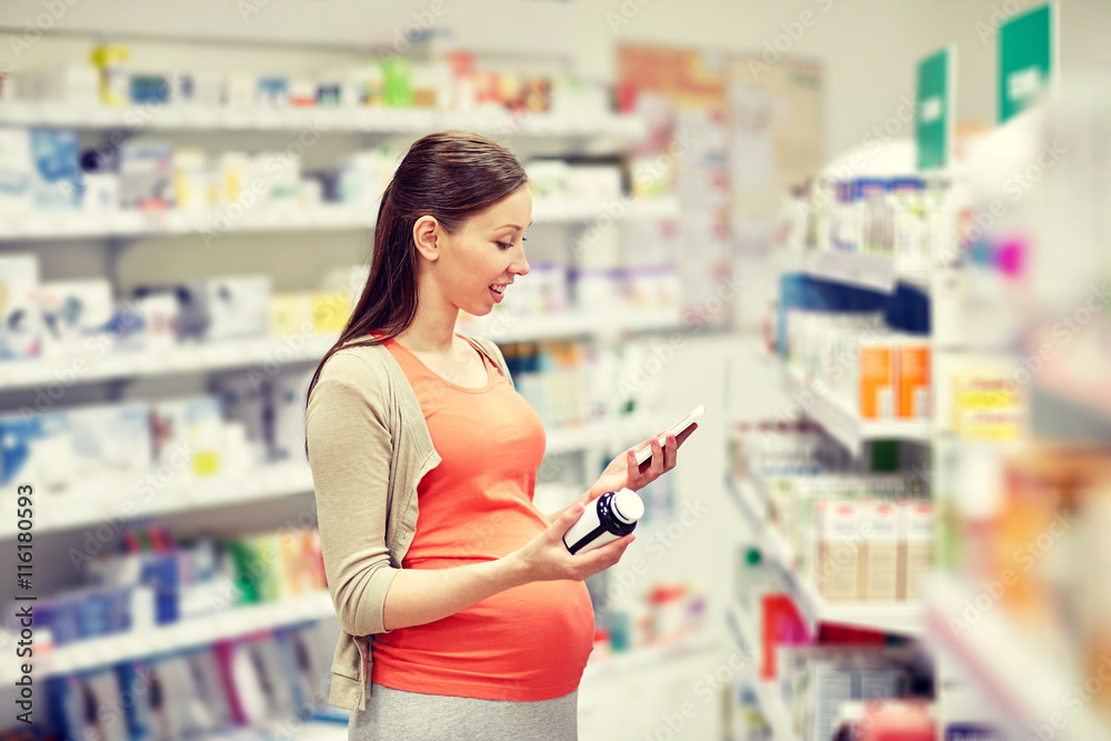 happy pregnant woman with smartphone at pharmacy