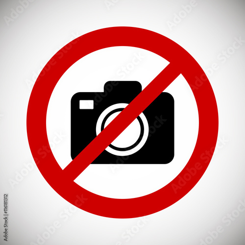 Camera in red ban on a white background. No photography