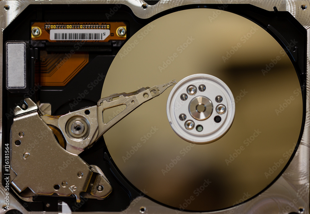 disassembled hard drive and open computer looking inside