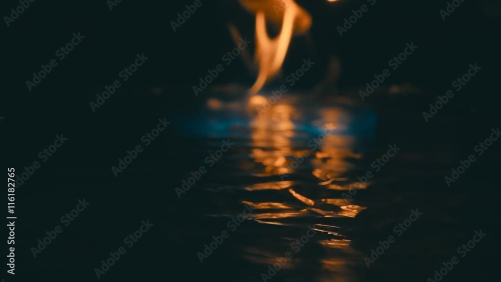 A lit match ignites gasoline. Blue Wave at the forefront of fire go to meet. S-log - High Dynamic Range. Slow motion, high speed camera, 250fps