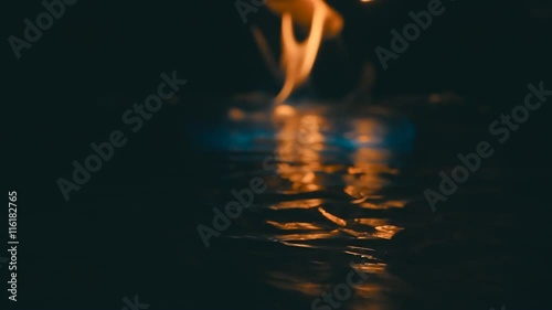 A lit match ignites gasoline. Blue Wave at the forefront of fire go to meet. S-log - High Dynamic Range. Slow motion, high speed camera, 250fps