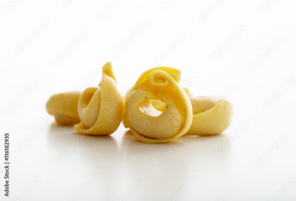 Tortellini pasta on white background Tortellini pasta on white background
